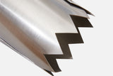 A handheld sharp metal tool for cutting holes in mulch or landscaping materials