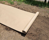 A roll of Organic Biodegradable Paper EcoMulch lying on the ground