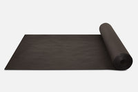 Biodegradable Paper Mulch rolled up on a white surface